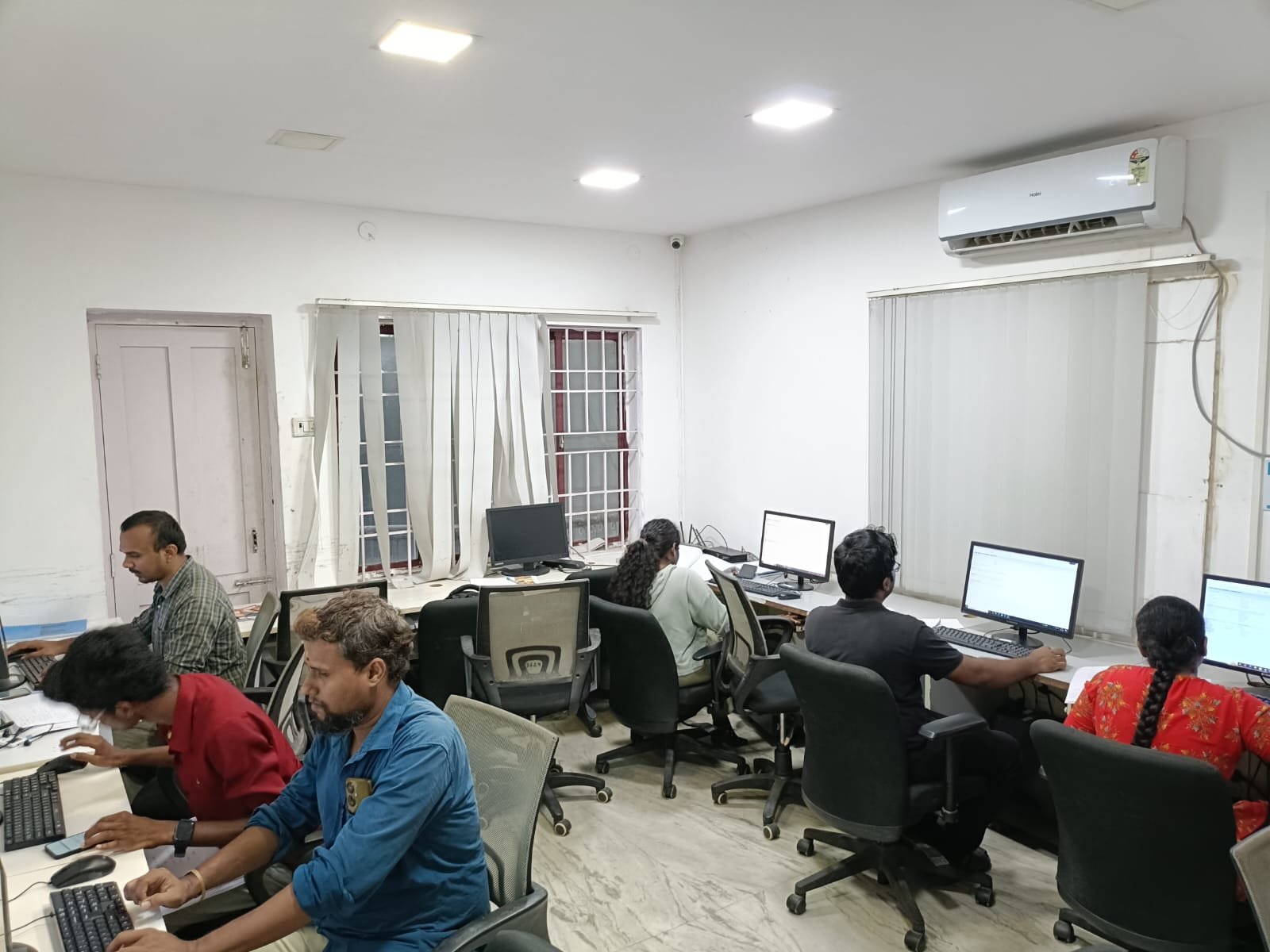 Students and staff working at desks at Techmaax Anna Nagar